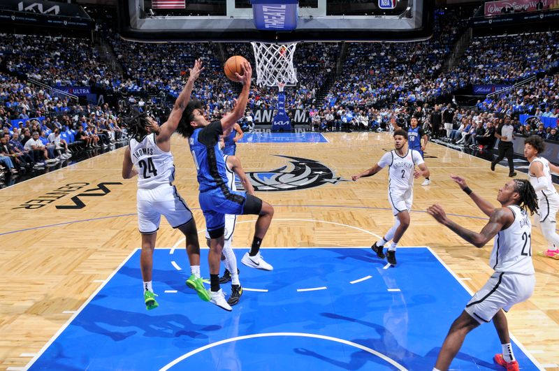 ORLANDO, FL - OCTOBER 25: Anthony Black #0 of the Orlando Magic drives to the basket during the game against the Brooklyn Nets  on October 25, 2024 at Kia Center in Orlando, Florida. NOTE TO USER: User expressly acknowledges and agrees that, by downloading and or using this photograph, User is consenting to the terms and conditions of the Getty Images License Agreement. Mandatory Copyright Notice: Copyright 2024 NBAE (Photo by Fernando Medina/NBAE via Getty Images)