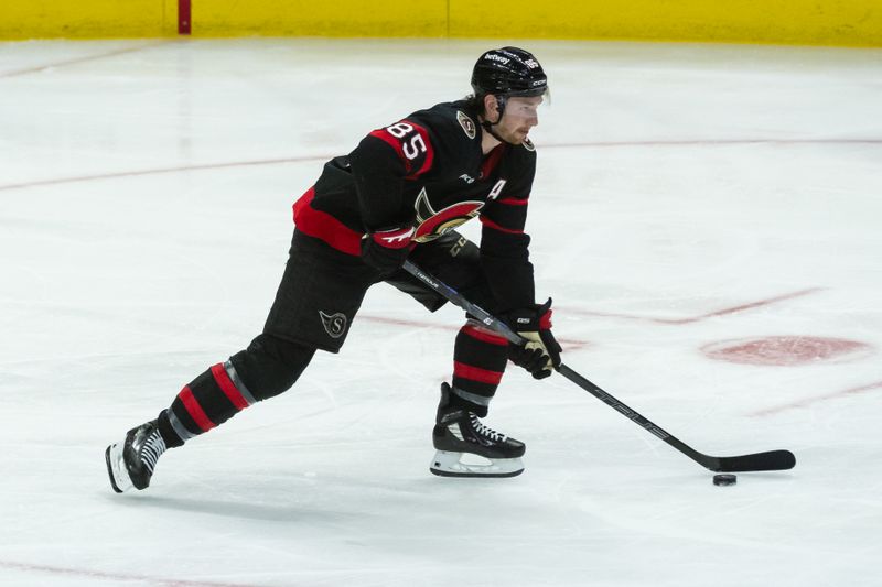 Apr 5, 2025; Ottawa, Ontario, CAN; Ottawa Senators defenseman Jake Sanderson (85) skates with the puck in the third period against the Florida Panthers at the Canadian Tire Centre. Mandatory Credit: Marc DesRosiers-Imagn Images
