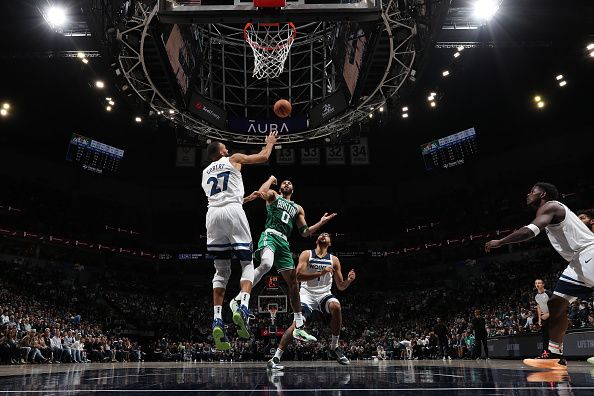 MINNEAPOLIS, MN -  NOVEMBER 6:  Rudy Gobert #27 of the Minnesota Timberwolves and Jayson Tatum #0 of the Boston Celtics battle for a rebound on November 6, 2023 at Target Center in Minneapolis, Minnesota. NOTE TO USER: User expressly acknowledges and agrees that, by downloading and or using this Photograph, user is consenting to the terms and conditions of the Getty Images License Agreement. Mandatory Copyright Notice: Copyright 2023 NBAE (Photo by Jordan Johnson/NBAE via Getty Images)