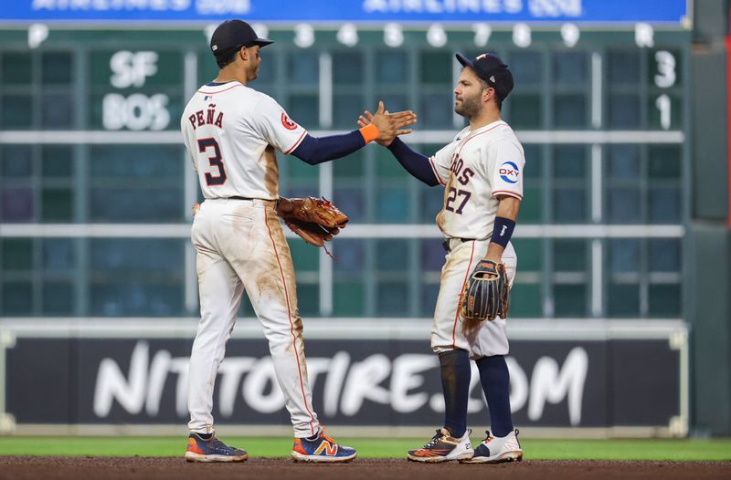 May 2, 2024; Houston, Texas, USA; Houston Astros shortstop Jeremy Pena (3) and second baseman Jose Altuve (27) celebrate after the game against the Cleveland Guardians at Minute Maid Park. Mandatory Credit: Troy Taormina-USA TODAY Sports