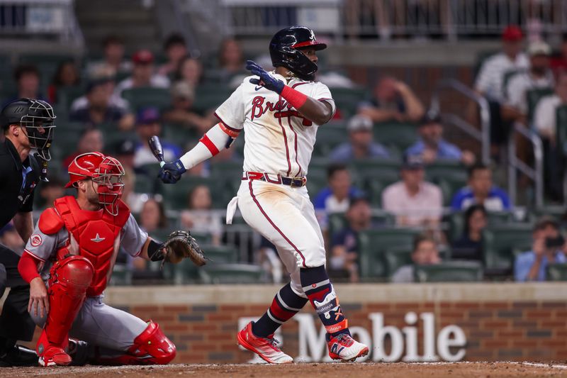 May 8, 2025; Atlanta, Georgia, USA; Atlanta Braves center fielder Michael Harris II (23) hits an RBI single against the Cincinnati Reds in the ninth inning at Truist Park. Mandatory Credit: Brett Davis-Imagn Images
