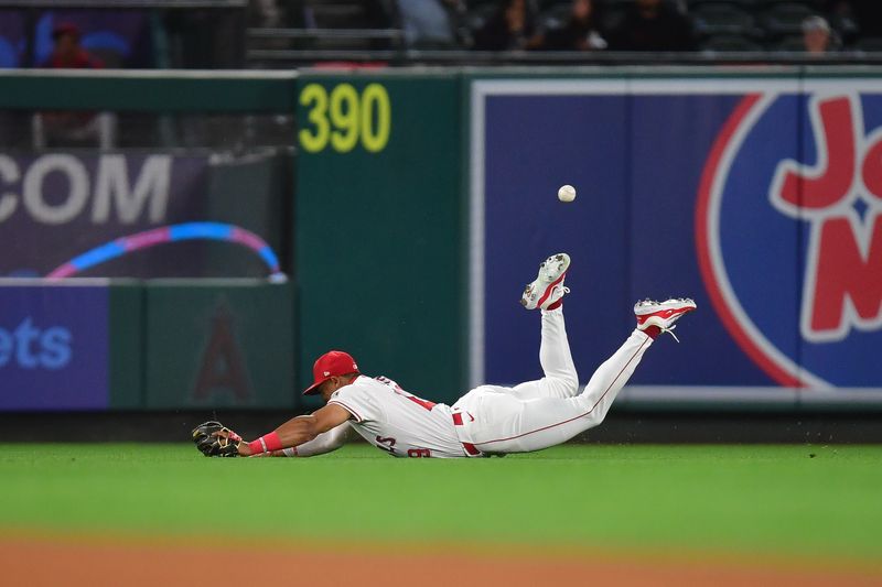 May 6, 2025; Anaheim, California, USA; Los Angeles Angels center fielder Kyren Paris (19) misses the double of Toronto Blue Jays second baseman Andres Gimenez (0) during the fifth inning at Angel Stadium. Mandatory Credit: Gary A. Vasquez-Imagn Images