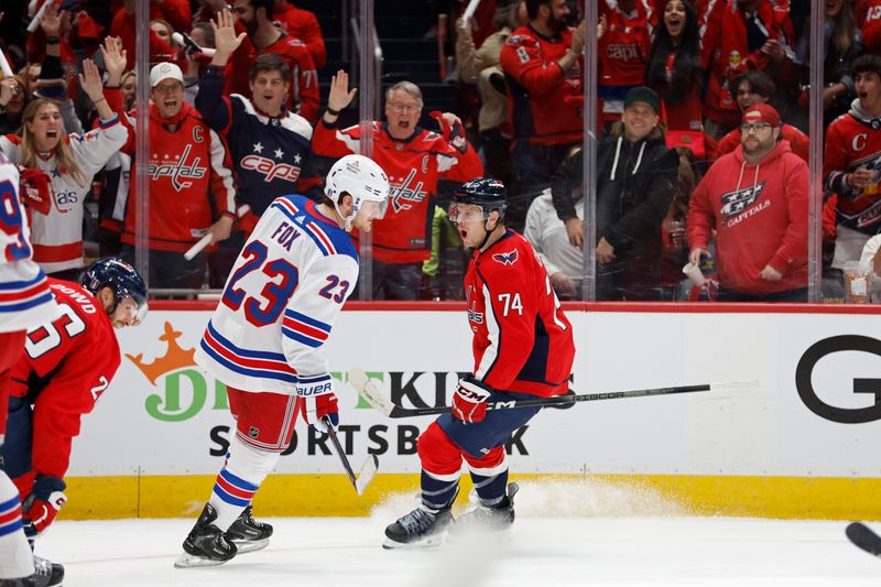 Apr 26, 2024; Washington, District of Columbia, USA; Washington Capitals defenseman John Carlson (74) celebrates after scoring a goal against the New York Rangers in the first period in game three of the first round of the 2024 Stanley Cup Playoffs at Capital One Arena. Mandatory Credit: Geoff Burke-USA TODAY Sports