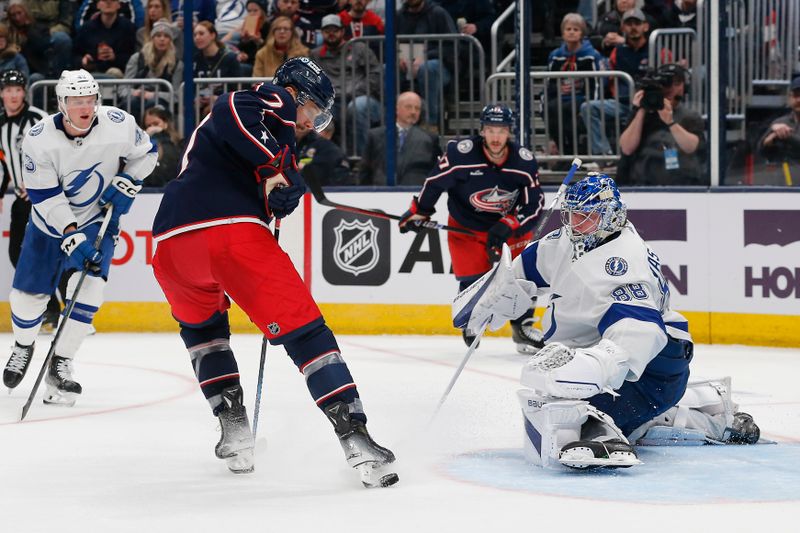 Feb 10, 2024; Columbus, Ohio, USA; Columbus Blue Jackets center Sean Kuraly (7) kicks at the rebound of a Tampa Bay Lightning goalie Andrei Vasilevskiy (88) save during the second period at Nationwide Arena. Mandatory Credit: Russell LaBounty-USA TODAY Sports