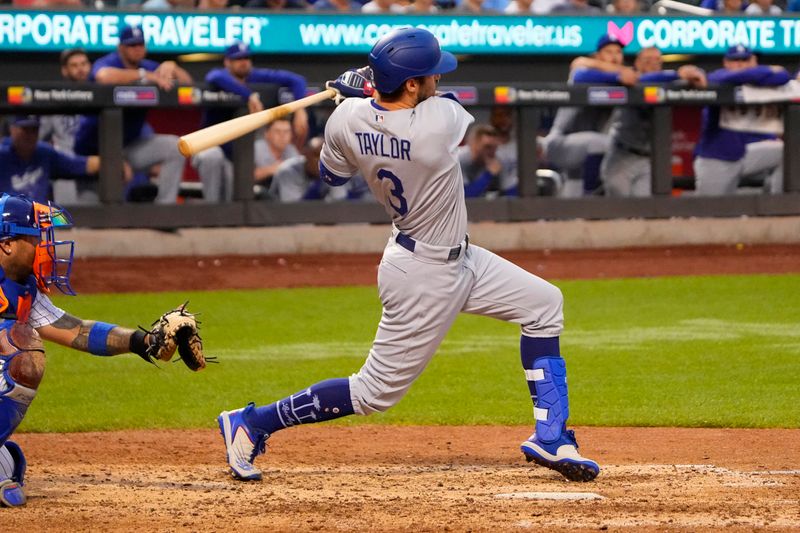 Jul 16, 2023; New York City, New York, USA; Los Angeles Dodgers shortstop Chris Taylor (3) hits a double against the New York Mets during the ninth inning at Citi Field. Mandatory Credit: Gregory Fisher-USA TODAY Sports