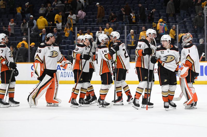 Jan 9, 2024; Nashville, Tennessee, USA; Anaheim Ducks players celebrate after a win against the Nashville Predators at Bridgestone Arena. Mandatory Credit: Christopher Hanewinckel-USA TODAY Sports