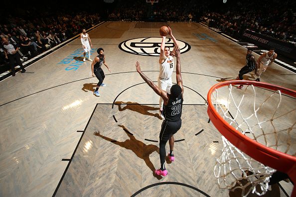 BROOKLYN, NY - DECEMBER 22: Nikola Jokic #15 of the Denver Nuggets shoots the ball during the game  on December 22, 2023 at Barclays Center in Brooklyn, New York. NOTE TO USER: User expressly acknowledges and agrees that, by downloading and or using this Photograph, user is consenting to the terms and conditions of the Getty Images License Agreement. Mandatory Copyright Notice: Copyright 2023 NBAE (Photo by Nathaniel S. Butler/NBAE via Getty Images)