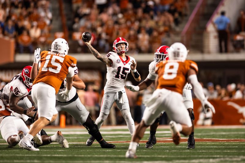 Oct 19, 2024; Austin, Texas, USA; Georgia Bulldogs quarterback Carson Beck (15) drops back to pass against the Texas Longhorns at Darrell K Royal-Texas Memorial Stadium. Mandatory Credit: Brett Patzke-Imagn Images