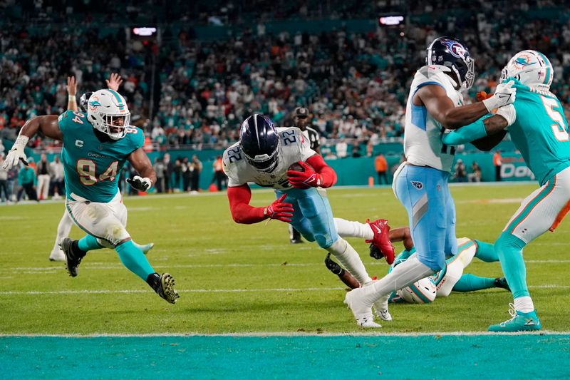 Tennessee Titans running back Derrick Henry (22) scores a touchdown during the second half of an NFL football game against the Miami Dolphins, Monday, Dec. 11, 2023, in Miami. (AP Photo/Lynne Sladky)