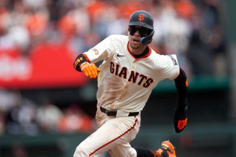 Apr 26, 2025; San Francisco, California, USA; San Francisco Giants second baseman Christian Koss (50) rounds second and heads for third on a double by Sam Huff against the Texas Rangers during the fifth inning at Oracle Park. Mandatory Credit: D. Ross Cameron-Imagn Images