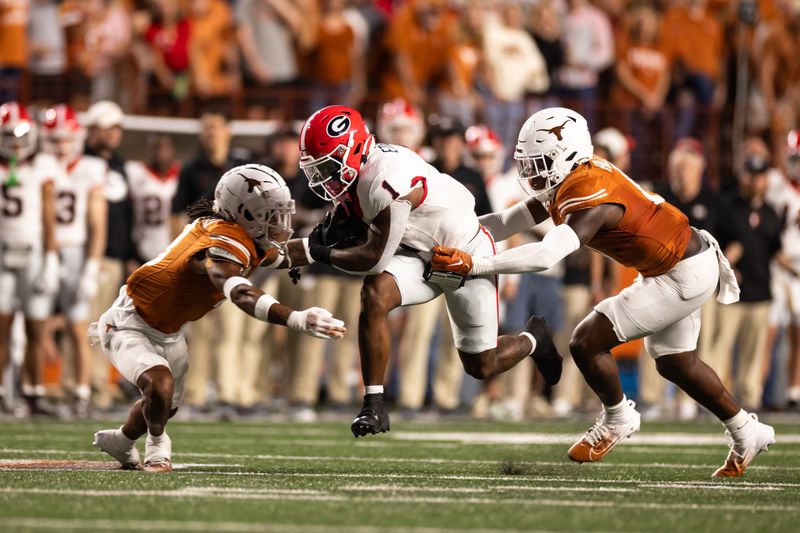 Oct 19, 2024; Austin, Texas, USA; Georgia Bulldogs running back Trevor Etienne (1) runs the ball against the Texas Longhorns during the first half at Darrell K Royal-Texas Memorial Stadium. Mandatory Credit: Brett Patzke-Imagn Images