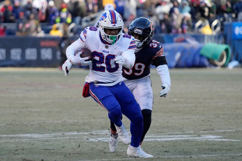 Buffalo Bills running back Nyheim Hines (20) runs past Chicago Bears cornerback Josh Blackwell during the second half of an NFL football game, Saturday, Dec. 24, 2022, in Chicago. The Bills won 35-13. (AP Photo/Nam Y. Huh)