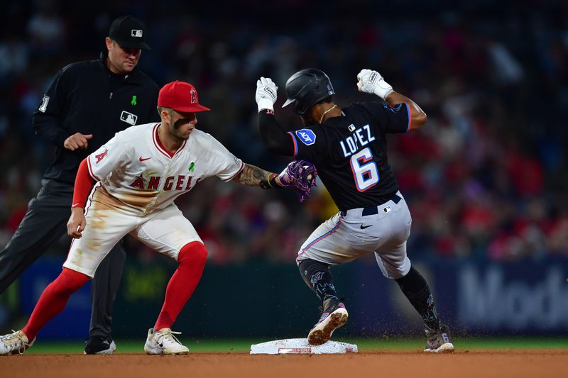 May 24, 2025; Anaheim, California, USA; Miami Marlins shortstop Otto Lopez (6) steals second against Los Angeles Angels shortstop Zach Neto (9) during the seventh inning at Angel Stadium. Mandatory Credit: Gary A. Vasquez-Imagn Images