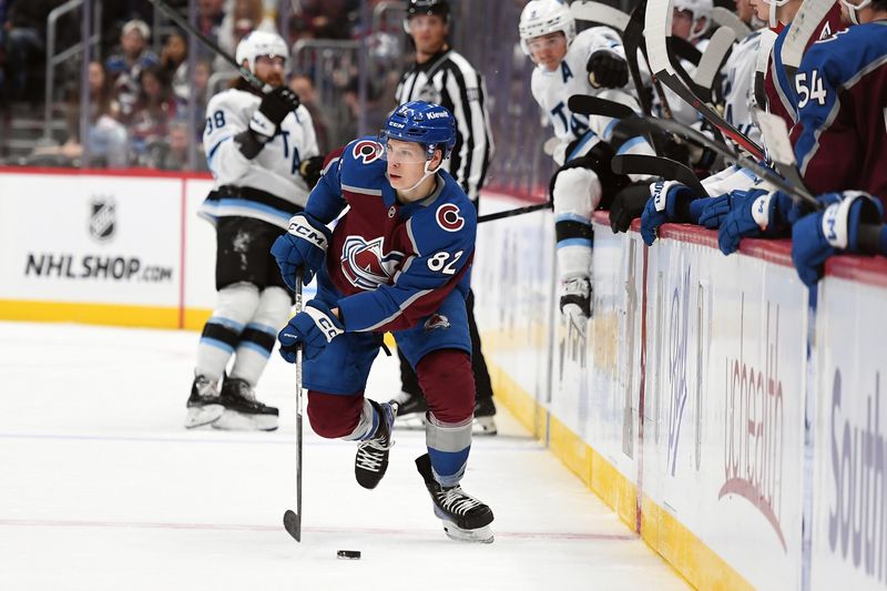 Sep 29, 2024; Denver, Colorado, USA; Colorado Avalanche center Ivan Ivan (82) skates with the puck during the second period against the Utah Hockey Club at Ball Arena. Mandatory Credit: Christopher Hanewinckel-Imagn Images