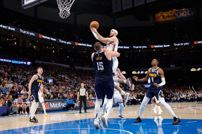 OKLAHOMA CITY, OK - MARCH 10: Alex Caruso #9 of the Oklahoma City Thunder drives to the basket during the game against the Denver Nuggets on March 10, 2025 at Paycom Center in Oklahoma City, Oklahoma. NOTE TO USER: User expressly acknowledges and agrees that, by downloading and or using this photograph, User is consenting to the terms and conditions of the Getty Images License Agreement. Mandatory Copyright Notice: Copyright 2025 NBAE (Photo by Martin McGrew/NBAE via Getty Images)