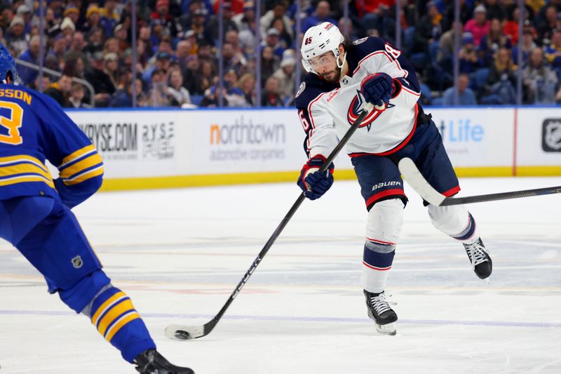 Dec 30, 2023; Buffalo, New York, USA;  Columbus Blue Jackets right wing Kirill Marchenko (86) takes a shot on goal during the third period against the Buffalo Sabres at KeyBank Center. Mandatory Credit: Timothy T. Ludwig-USA TODAY Sports