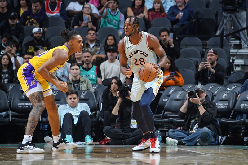 SAN ANTONIO, TX - NOVEMBER 27: Charles Bassey #28 of the San Antonio Spurs dribbles the ball during the game against the Los Angeles Lakers on November 27, 2024 at the Frost Bank Center in San Antonio, Texas. NOTE TO USER: User expressly acknowledges and agrees that, by downloading and or using this photograph, user is consenting to the terms and conditions of the Getty Images License Agreement. Mandatory Copyright Notice: Copyright 2024 NBAE (Photos by Michael Gonzales/NBAE via Getty Images)