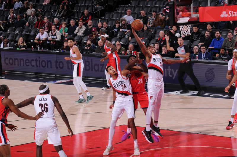 PORTLAND, OR - JANUARY 16:  Jabari Walker #34 of the Portland Trail Blazers grabs a rebound during the game against the LA Clippers on January 16, 2025 at the Moda Center Arena in Portland, Oregon. NOTE TO USER: User expressly acknowledges and agrees that, by downloading and or using this photograph, user is consenting to the terms and conditions of the Getty Images License Agreement. Mandatory Copyright Notice: Copyright 2025 NBAE (Photo by Cameron Browne/NBAE via Getty Images)