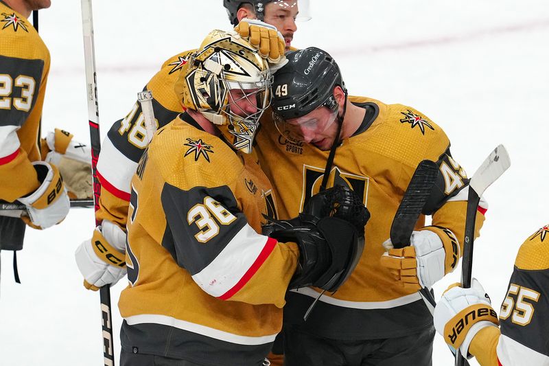 Apr 16, 2024; Las Vegas, Nevada, USA; Vegas Golden Knights goaltender Logan Thompson (36) celebrates with center Ivan Barbashev (49) after the Golden Knights defeated the Chicago Blackhawks 3-1 at T-Mobile Arena. Mandatory Credit: Stephen R. Sylvanie-USA TODAY Sports