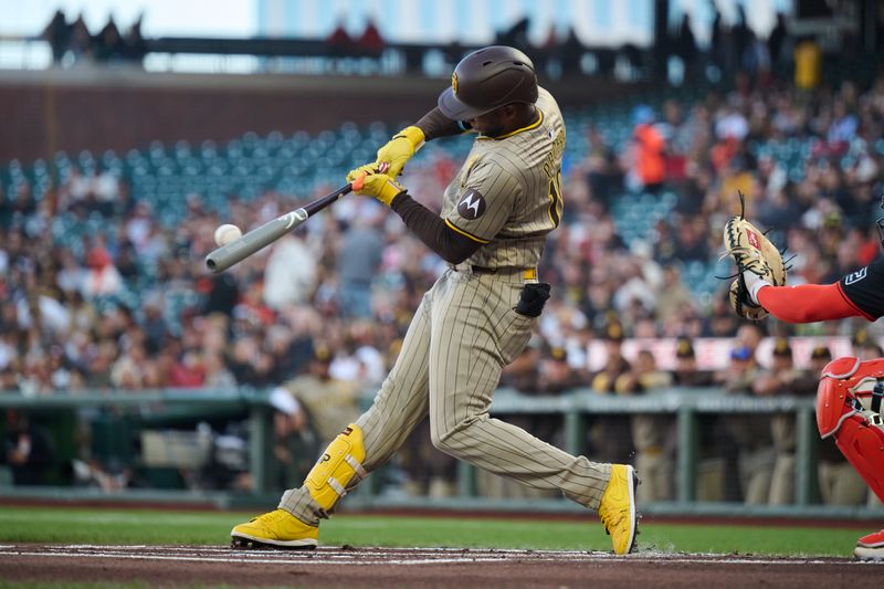 Sep 14, 2024; San Francisco, California, USA; San Diego Padres outfielder Jurickson Profar (10) hits a single against the San Francisco Giants during the first inning at Oracle Park. Mandatory Credit: Robert Edwards-Imagn Images