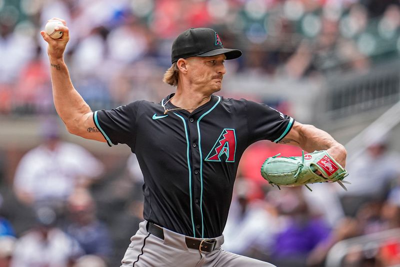 Jun 5, 2025; Cumberland, Georgia, USA; Arizona Diamondbacks relief pitcher Shelby Miller (18) pitches against the Atlanta Braves during the ninth inning at Truist Park. Mandatory Credit: Dale Zanine-Imagn Images