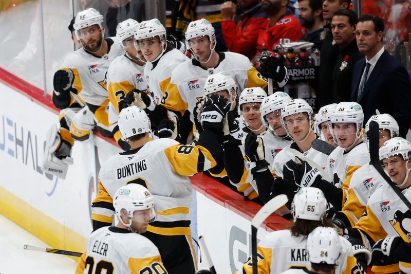 Nov 8, 2024; Washington, District of Columbia, USA; Pittsburgh Penguins left wing Michael Bunting (8) celebrates with teammates after scoring a goal against the Washington Capitals in the first period at Capital One Arena. Mandatory Credit: Geoff Burke-Imagn Images