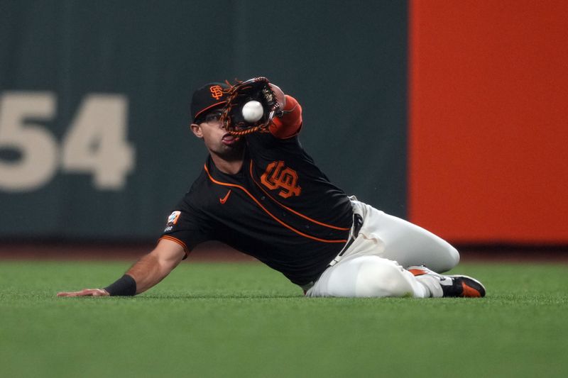 Sep 9, 2023; San Francisco, California, USA; San Francisco Giants left fielder Blake Sabol (2) makes a diving catch against the Colorado Rockies during the seventh inning at Oracle Park. Mandatory Credit: Darren Yamashita-USA TODAY Sports