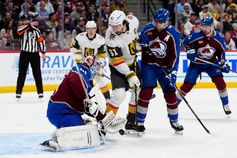 Apr 8, 2025; Denver, Colorado, USA; Vegas Golden Knights right wing Mark Stone (61) redirects the puck at Colorado Avalanche goaltender Scott Wedgewood (41) as defenseman Devon Toews (7) defends in the first period at Ball Arena. Mandatory Credit: Ron Chenoy-Imagn Images