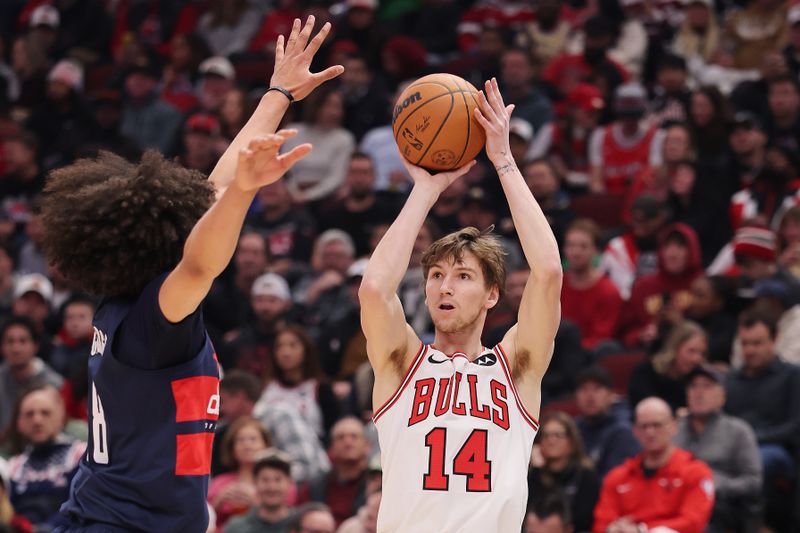 CHICAGO, ILLINOIS - JANUARY 10: Matas Buzelis #14 of the Chicago Bulls shoots a three pointer over Kyshawn George #18 of the Washington Wizards during the second half at the United Center on January 10, 2025 in Chicago, Illinois. NOTE TO USER: User expressly acknowledges and agrees that, by downloading and or using this photograph, User is consenting to the terms and conditions of the Getty Images License Agreement.  (Photo by Michael Reaves/Getty Images)