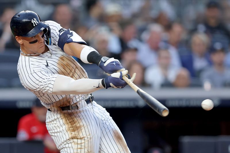Jun 6, 2025; Bronx, New York, USA; New York Yankees right fielder Aaron Judge (99) hits a single against the Boston Red Sox during the second inning at Yankee Stadium. Mandatory Credit: Brad Penner-Imagn Images