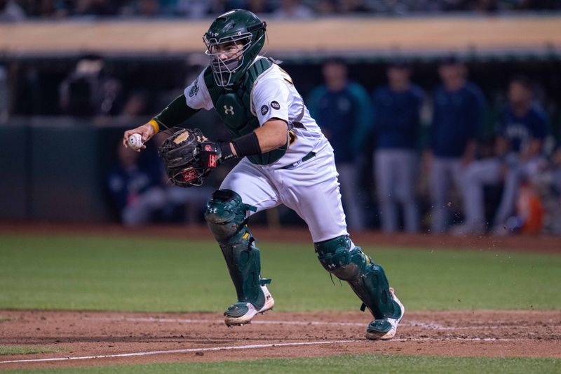 Sep 19, 2023; Oakland, California, USA; Oakland Athletics relief pitcher Dany Jimenez (56) has Seattle Mariners second baseman Sam Haggerty (not pictured) in a run down during the seventh inning at Oakland-Alameda County Coliseum. Mandatory Credit: Neville E. Guard-USA TODAY Sports