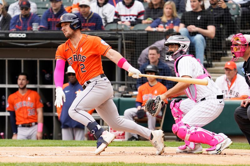 May 14, 2023; Chicago, Illinois, USA; Houston Astros third baseman Alex Bregman (2) hits a single against the Chicago White Sox during the first inning at Guaranteed Rate Field. Mandatory Credit: David Banks-USA TODAY Sports