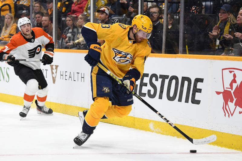 Dec 12, 2023; Nashville, Tennessee, USA; Nashville Predators center Yakov Trenin (13) handles the puck during the second period against the Philadelphia Flyers at Bridgestone Arena. Mandatory Credit: Christopher Hanewinckel-USA TODAY Sports