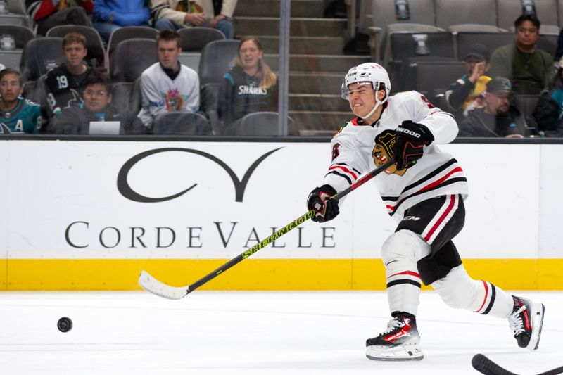 Oct 31, 2024; San Jose, California, USA; Chicago Blackhawks center Connor Bedard (98) takes a shot on goal against the San Jose Sharks during the first period at SAP Center at San Jose. Mandatory Credit: D. Ross Cameron-Imagn Images