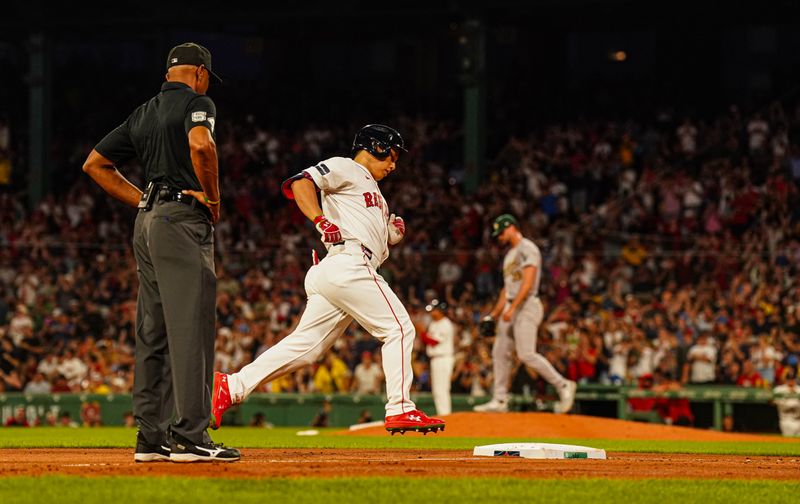 Jul 11, 2024; Boston, Massachusetts, USA; Boston Red Sox designated hitter Masataka Yoshida (7) rounds the base after hitting a two run home run against the Oakland Athletics in the sixth inning at Fenway Park. Mandatory Credit: David Butler II-USA TODAY Sports