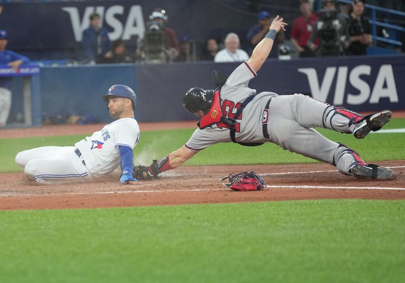 May 12, 2023; Toronto, Ontario, CAN; Toronto Blue Jays center fielder Kevin Kiermaier (39) is tagged out at home plate by Atlanta Braves catcher Sean Murphy (12) during the fifth inning at Rogers Centre. Mandatory Credit: Nick Turchiaro-USA TODAY Sports