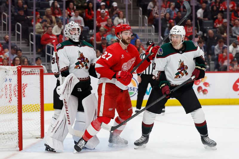 Mar 14, 2024; Detroit, Michigan, USA;  Detroit Red Wings center Michael Rasmussen (27) and Arizona Coyotes defenseman Josh Brown (3) fight for position in front of goaltender Connor Ingram (39) in the second period at Little Caesars Arena. Mandatory Credit: Rick Osentoski-USA TODAY Sports