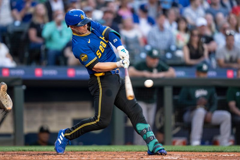 May 10, 2024; Seattle, Washington, USA; Seattle Mariners first baseman Ty France (23) hits a two-run double during the fourth inning against the Oakland Athletics at T-Mobile Park. Mandatory Credit: Stephen Brashear-USA TODAY Sports