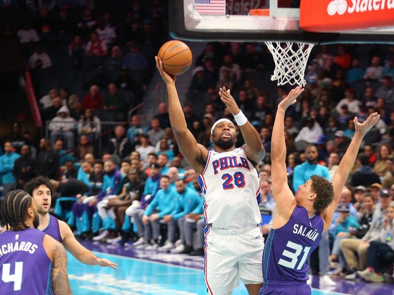 CHARLOTTE, NC - DECEMBER 3: Guerschon Yabusele #28 of the Philadelphia 76ers drives to the basket during the game against the Charlotte Hornets during an NBA Emirates Cup game on December 3, 2024 at Spectrum Center in Charlotte, North Carolina. NOTE TO USER: User expressly acknowledges and agrees that, by downloading and or using this photograph, User is consenting to the terms and conditions of the Getty Images License Agreement. Mandatory Copyright Notice: Copyright 2024 NBAE (Photo by Kent Smith/NBAE via Getty Images)