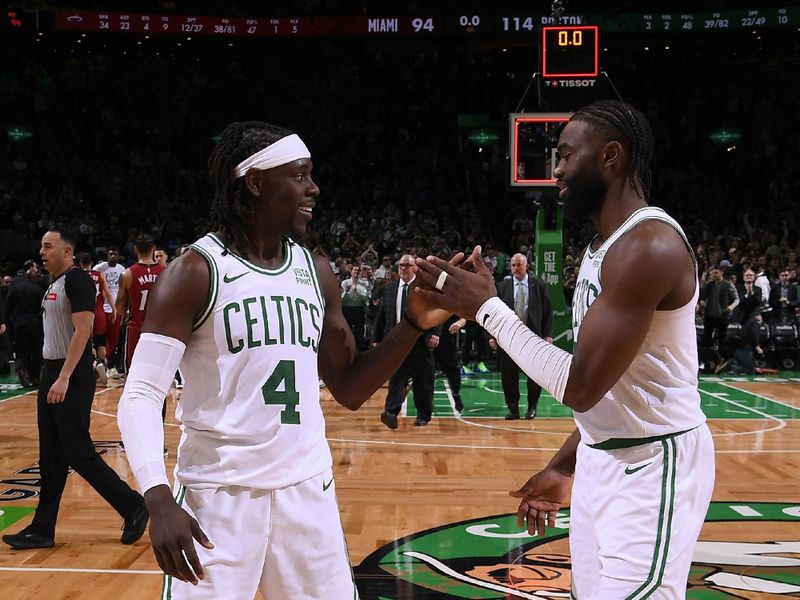 BOSTON, MA - APRIL 21: Jrue Holiday #4 high fives Jaylen Brown #7 of the Boston Celtics after the game against the Miami Heat during Round 1 Game 1 of the 2024 NBA Playoffs on April 21, 2024 at the TD Garden in Boston, Massachusetts. NOTE TO USER: User expressly acknowledges and agrees that, by downloading and or using this photograph, User is consenting to the terms and conditions of the Getty Images License Agreement. Mandatory Copyright Notice: Copyright 2024 NBAE  (Photo by Brian Babineau/NBAE via Getty Images)