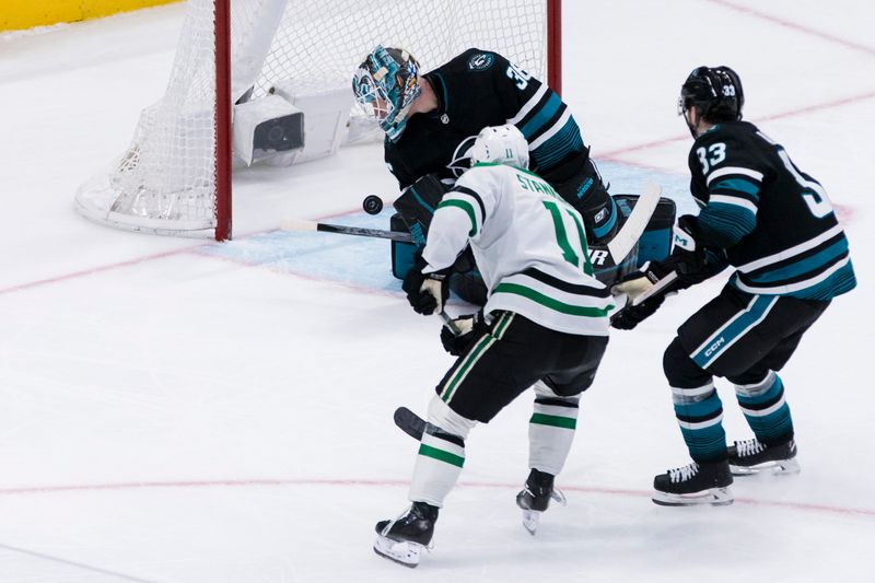 Mar 5, 2024; San Jose, California, USA; Dallas Stars center Logan Stankoven (11) scores on San Jose Sharks goaltender Kaapo Kahkonen (36) as defenseman Calen Addison (33) defends during the third period at SAP Center at San Jose. Mandatory Credit: John Hefti-USA TODAY Sports