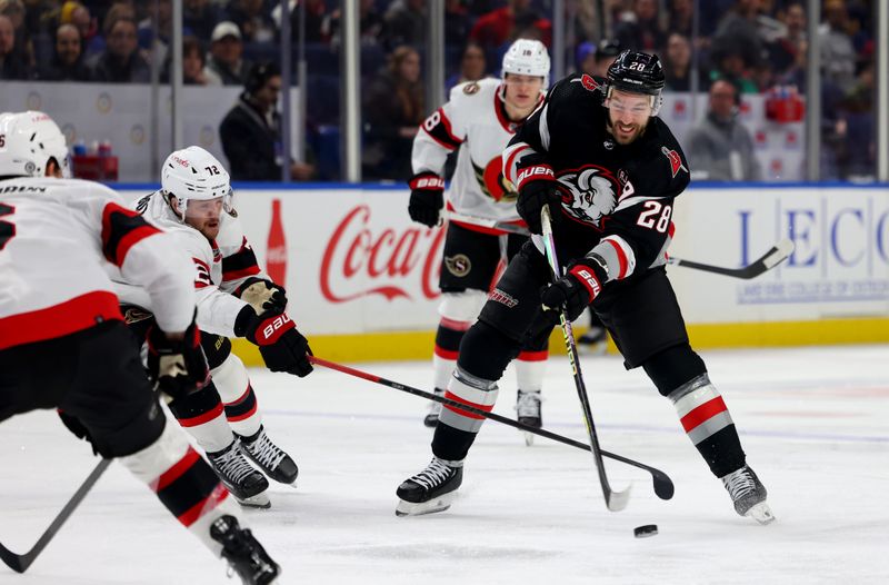 Jan 11, 2024; Buffalo, New York, USA;  Ottawa Senators defenseman Thomas Chabot (72) blocks a shot by Buffalo Sabres left wing Zemgus Girgensons (28) with his stick during the third period at KeyBank Center. Mandatory Credit: Timothy T. Ludwig-USA TODAY Sports