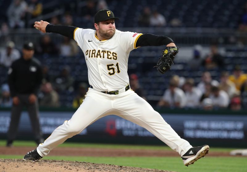 May 19, 2025; Pittsburgh, Pennsylvania, USA;  Pittsburgh Pirates relief pitcher David Bednar (51) pitches against the Cincinnati Reds during the eighth inning at PNC Park. Mandatory Credit: Charles LeClaire-Imagn Images