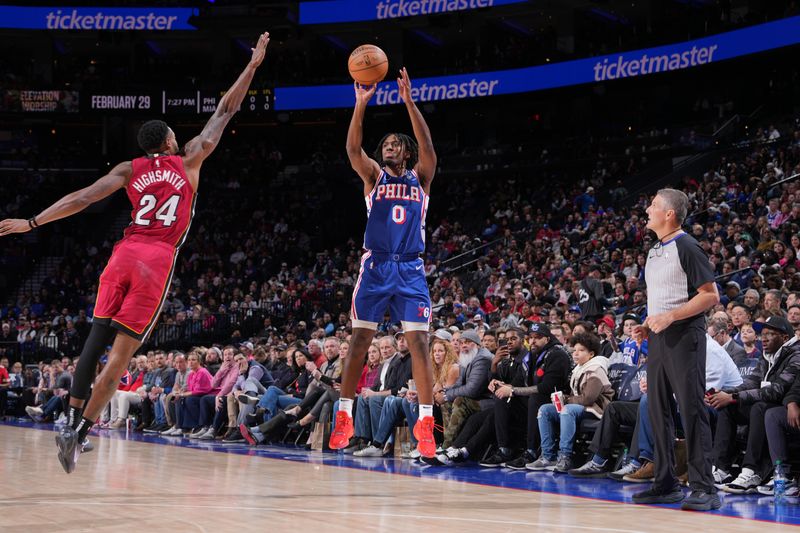 PHILADELPHIA, PA - FEBRUARY 14: Tyrese Maxey #0 of the Philadelphia 76ers shoots a three point basket during the game against the Miami Heat on February 14, 2024 at the Wells Fargo Center in Philadelphia, Pennsylvania NOTE TO USER: User expressly acknowledges and agrees that, by downloading and/or using this Photograph, user is consenting to the terms and conditions of the Getty Images License Agreement. Mandatory Copyright Notice: Copyright 2024 NBAE (Photo by Jesse D. Garrabrant/NBAE via Getty Images)