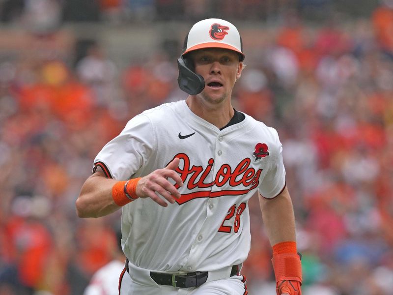 May 27, 2024; Baltimore, Maryland, USA; Baltimore Orioles outfielder Kyle Stowers (29) rounds third base to score in the fourth inning against the Boston Red Sox at Oriole Park at Camden Yards. Mandatory Credit: Mitch Stringer-USA TODAY Sports