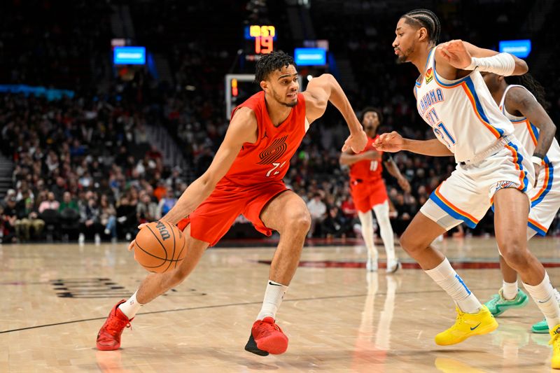 PORTLAND, OREGON - MARCH 06: Rayan Rupert #72 of the Portland Trail Blazers drives against Aaron Wiggins #21 of the Oklahoma City Thunder during the second quarter of the game at the Moda Center on March 06, 2024 in Portland, Oregon. NOTE TO USER: User expressly acknowledges and agrees that, by downloading and or using this photograph, User is consenting to the terms and conditions of the Getty Images License Agreement. (Photo by Alika Jenner/Getty Images)