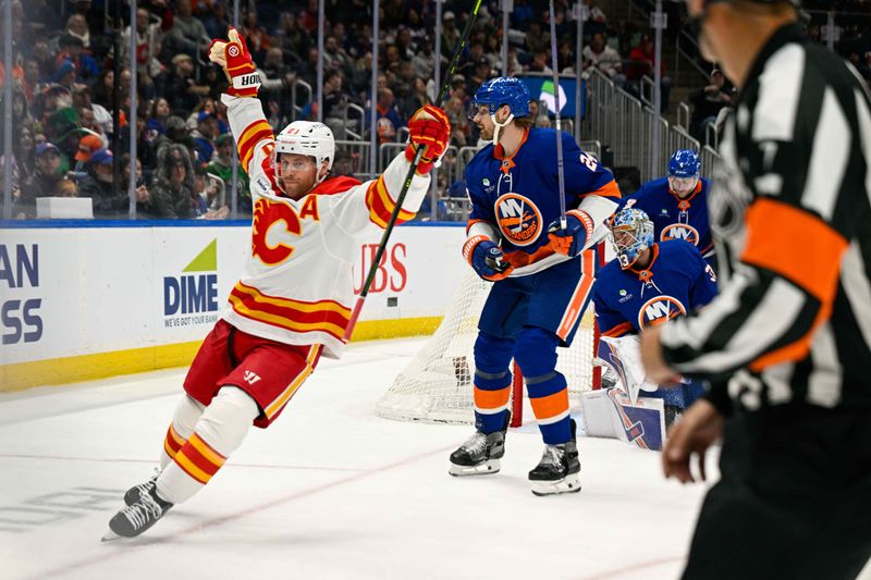 Mar 14, 2026; Elmont, New York, USA; Calgary Flames left wing Blake Coleman (20) celebrates his goal against the New York Islanders during the third period at UBS Arena. Mandatory Credit: Dennis Schneidler-Imagn Images Mar 14, 2026; Elmont, New York, USA; Calgary Flames left wing Blake Coleman (20) celebrates his goal against the New York Islanders during the third period at UBS Arena. Mandatory Credit: Dennis Schneidler-Imagn Images