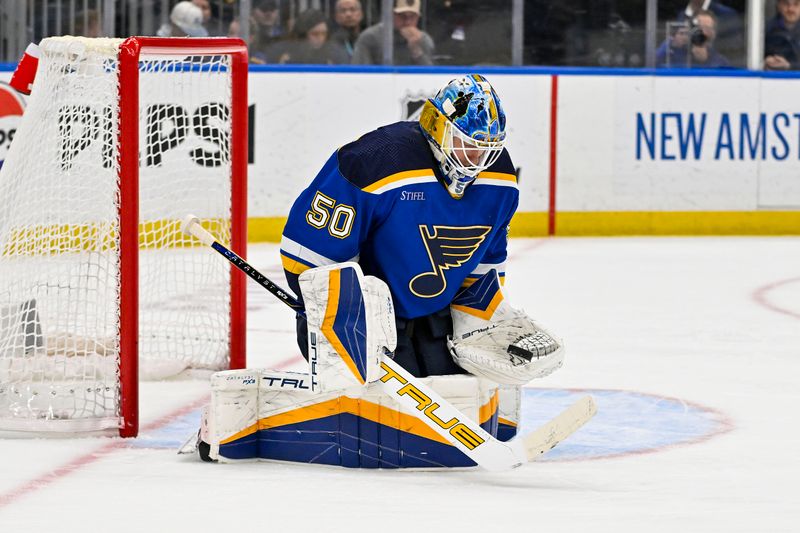 Mar 25, 2024; St. Louis, Missouri, USA;  St. Louis Blues goaltender Jordan Binnington (50) defends the net against the Vegas Golden Knights during the first period at Enterprise Center. Mandatory Credit: Jeff Curry-USA TODAY Sports