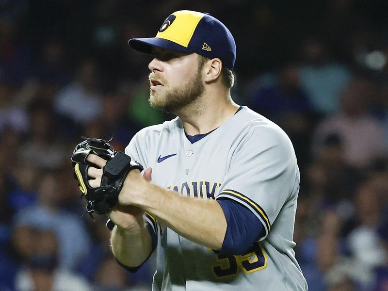 Aug 29, 2023; Chicago, Illinois, USA; Milwaukee Brewers starting pitcher Corbin Burnes (39) reacts after striking out Chicago Cubs third baseman Jeimer Candelario during the sixth inning at Wrigley Field. Mandatory Credit: Kamil Krzaczynski-USA TODAY Sports