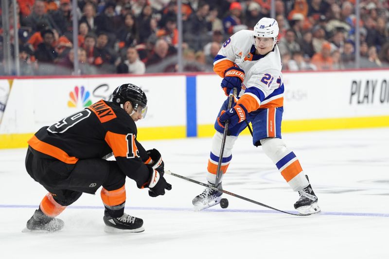 Apr 12, 2025; Philadelphia, Pennsylvania, USA; New York Islanders defenseman Alexander Romanov (28) passes the puck against the Philadelphia Flyers in the third period at Wells Fargo Center. Mandatory Credit: Kyle Ross-Imagn Images